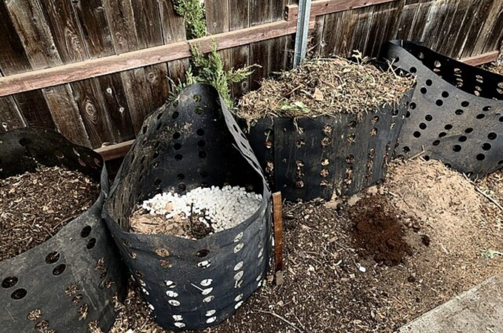 four humanure compost bins